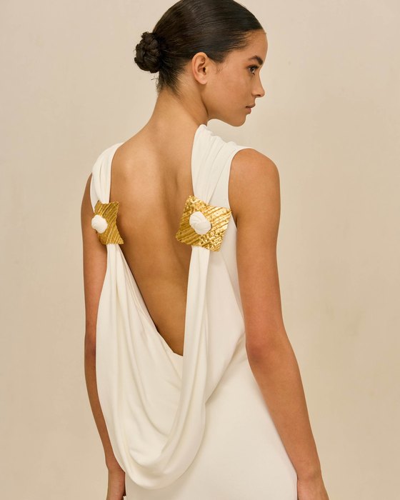 An off-white dress with a full skirt.